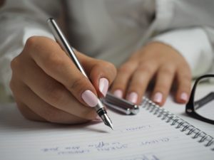 Woman making notes on her Will_Why should I write a Will_Body Image | Remember A Charity