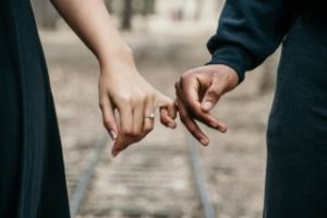 A man and a woman holding hands